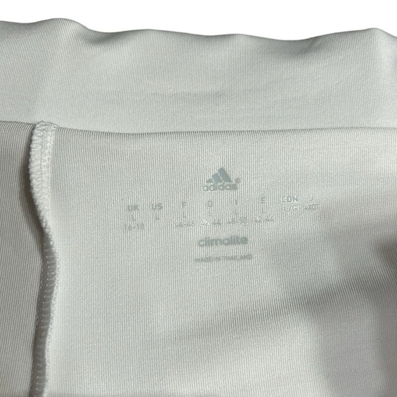 ADIDAS white skort with pleats on the bottom  half . Then two horizontal bands. - Picture 5 of 11